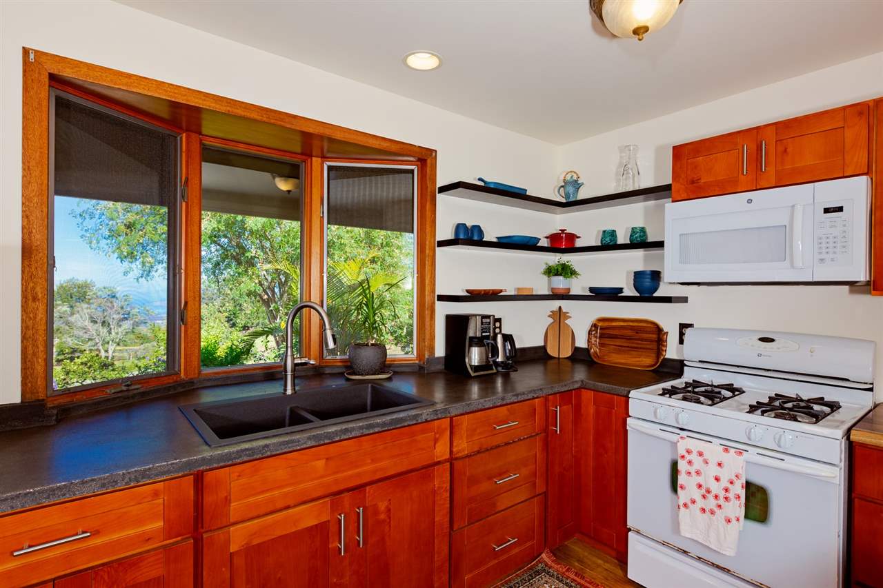 718 Holopuni Road Kula, HI 96790 - Photo 9 of 21 a kitchen with a stove a sink and a microwave