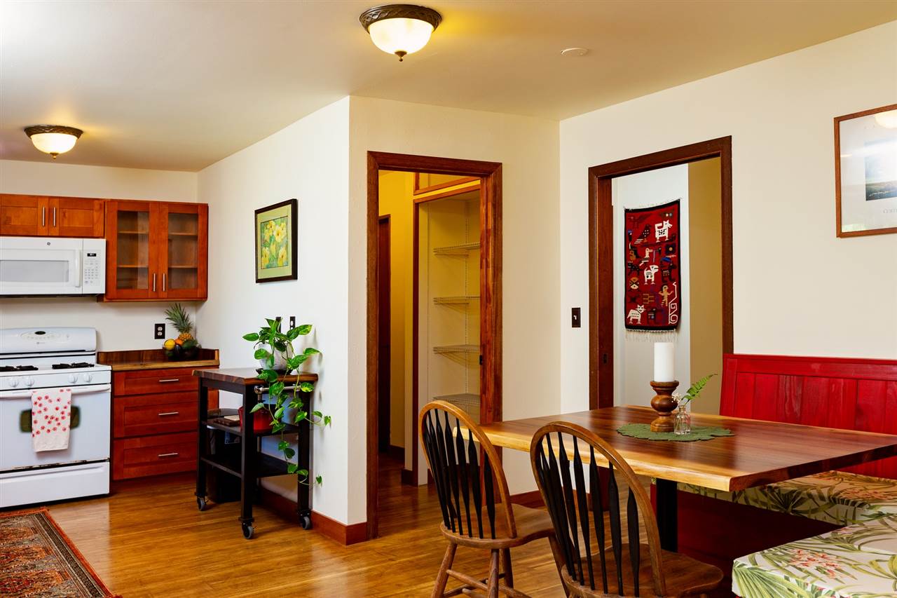 718 Holopuni Road Kula, HI 96790 - Photo 10 of 21 a view of a dining room with furniture and chandelier