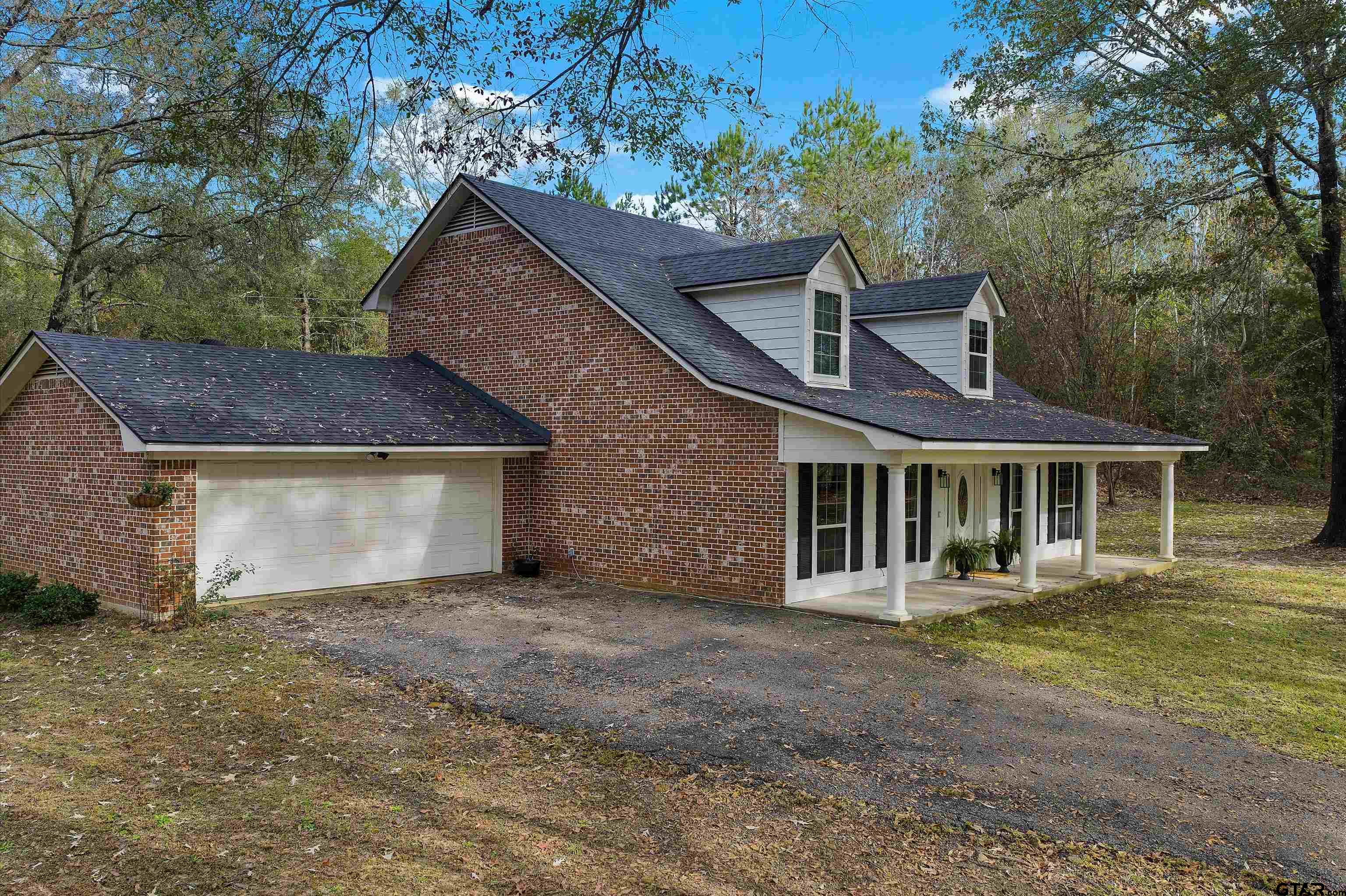 front view of a house with a yard