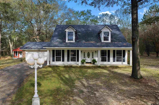 a front view of a house with swimming pool