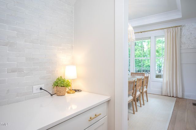 a view of kitchen with a table and a potted plant