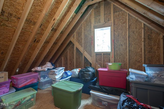 a backyard of a house with outdoor seating