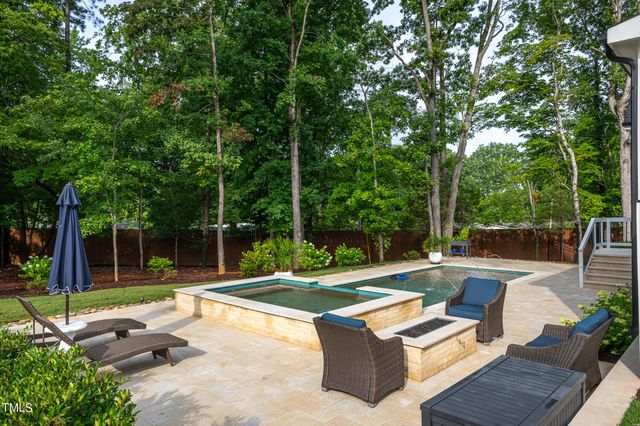 a view of swimming pool with a patio