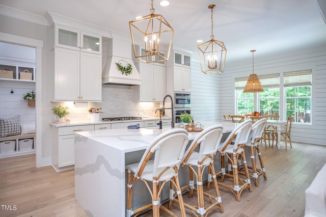 a very nice looking kitchen with granite countertop a large window and stainless steel appliances