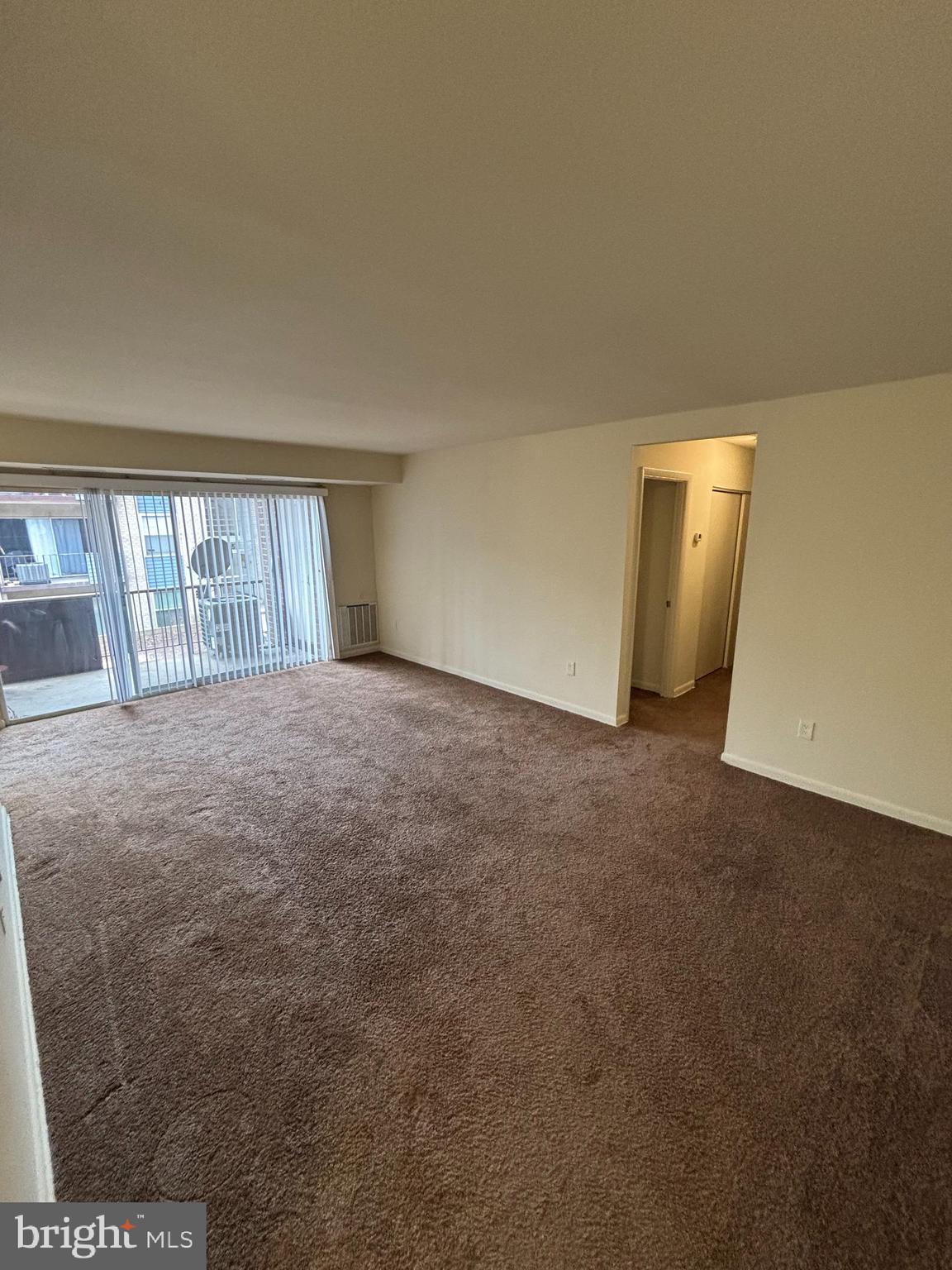 a view of an empty room and window