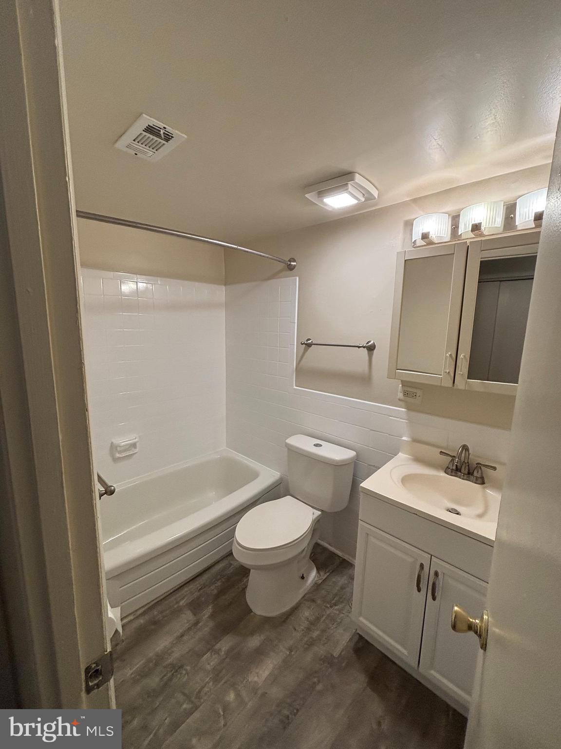 3827 St Barnabas Road, Unit T 103 Suitland, MD 20746 - Photo 12 of 15 a bathroom with a sink a toilet and shower
