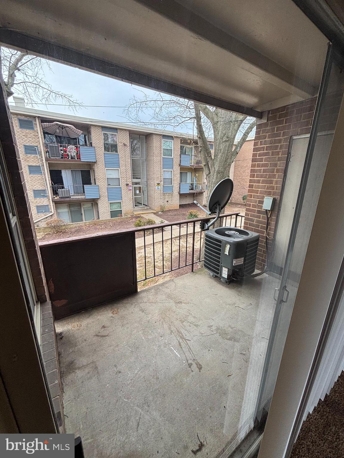 3827 St Barnabas Road, Unit T 103 Suitland, MD 20746 - Photo 15 of 15 a living room with furniture window and wooden floor