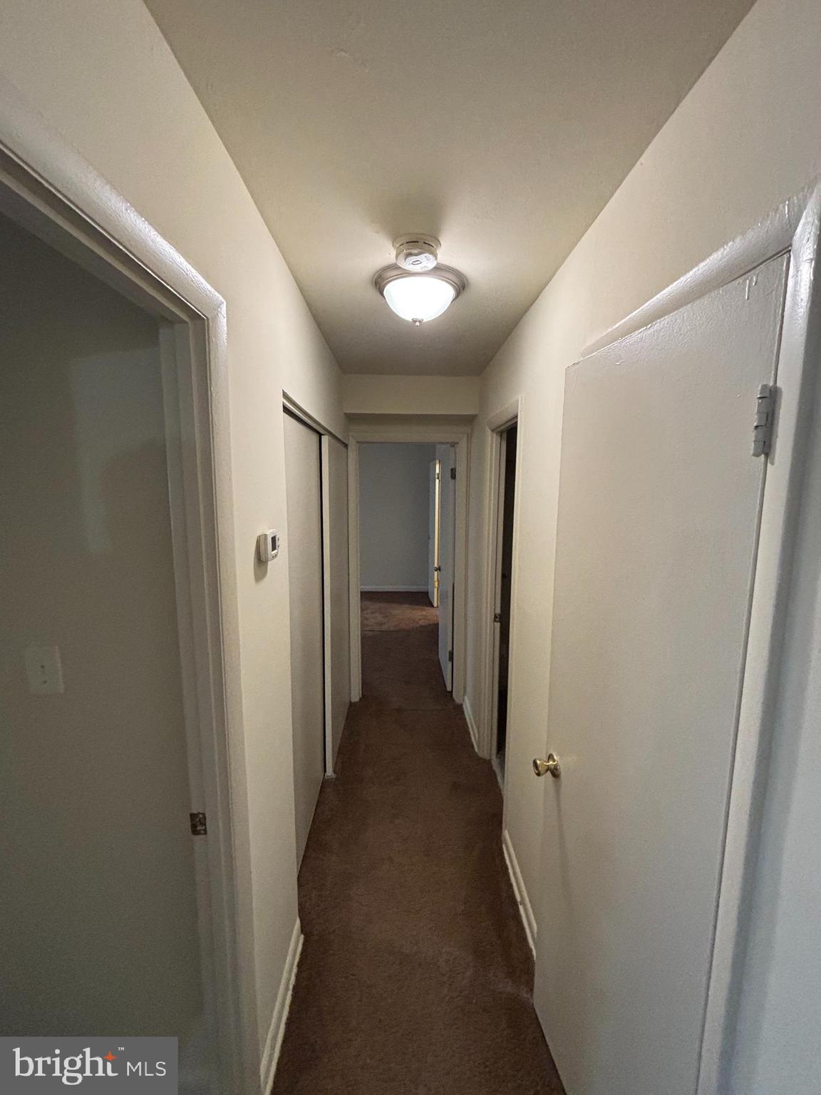 3827 St Barnabas Road, Unit T 103 Suitland, MD 20746 - Photo 6 of 15 a view of a hallway with a hallway