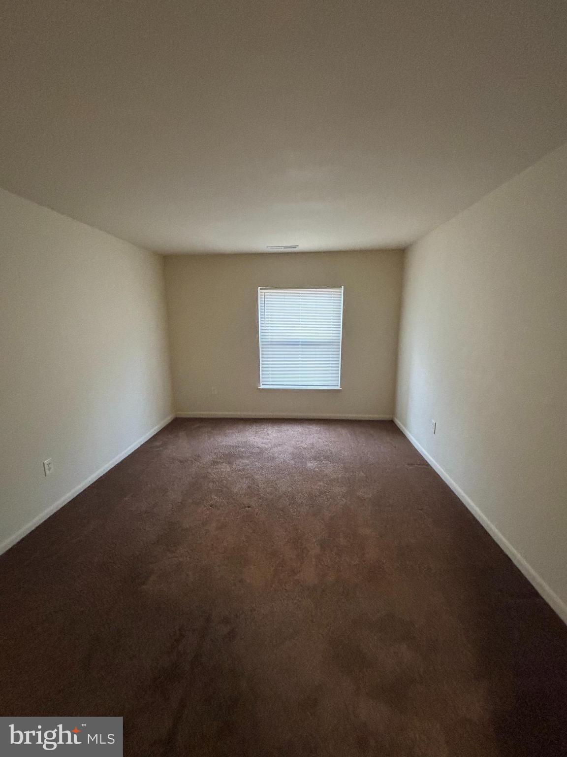 3827 St Barnabas Road, Unit T 103 Suitland, MD 20746 - Photo 10 of 15 an empty room with a empty space and window