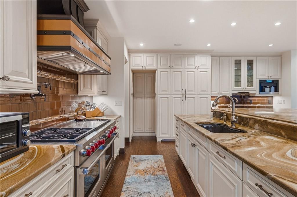 514 Justabout Road Venetia, PA 15367 - Photo 22 of 50 a kitchen with stainless steel appliances granite countertop a stove and a refrigerator
