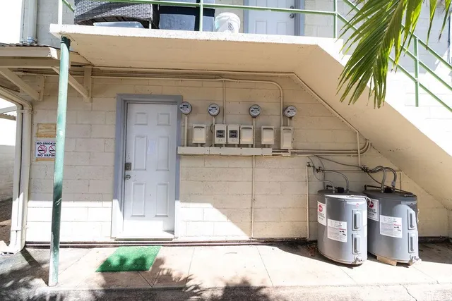 a view of a white building among the street