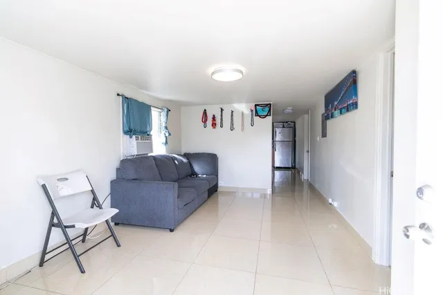 a kitchen with stainless steel appliances granite countertop a refrigerator a sink a stove and a refrigerator