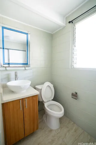 a kitchen with a stove a sink and a refrigerator