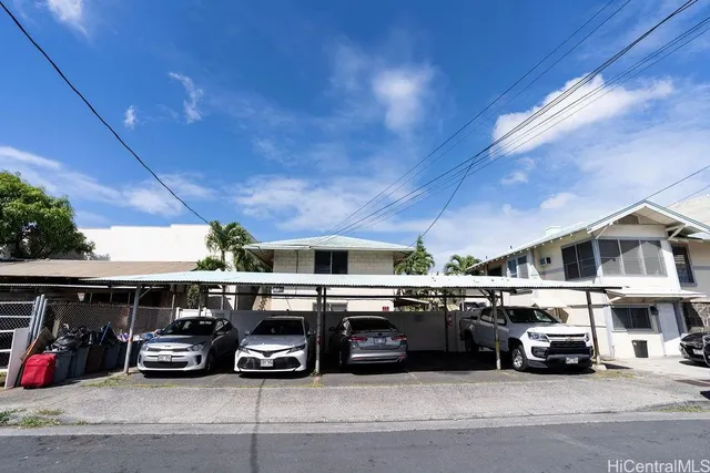 a view of parking garage with cars