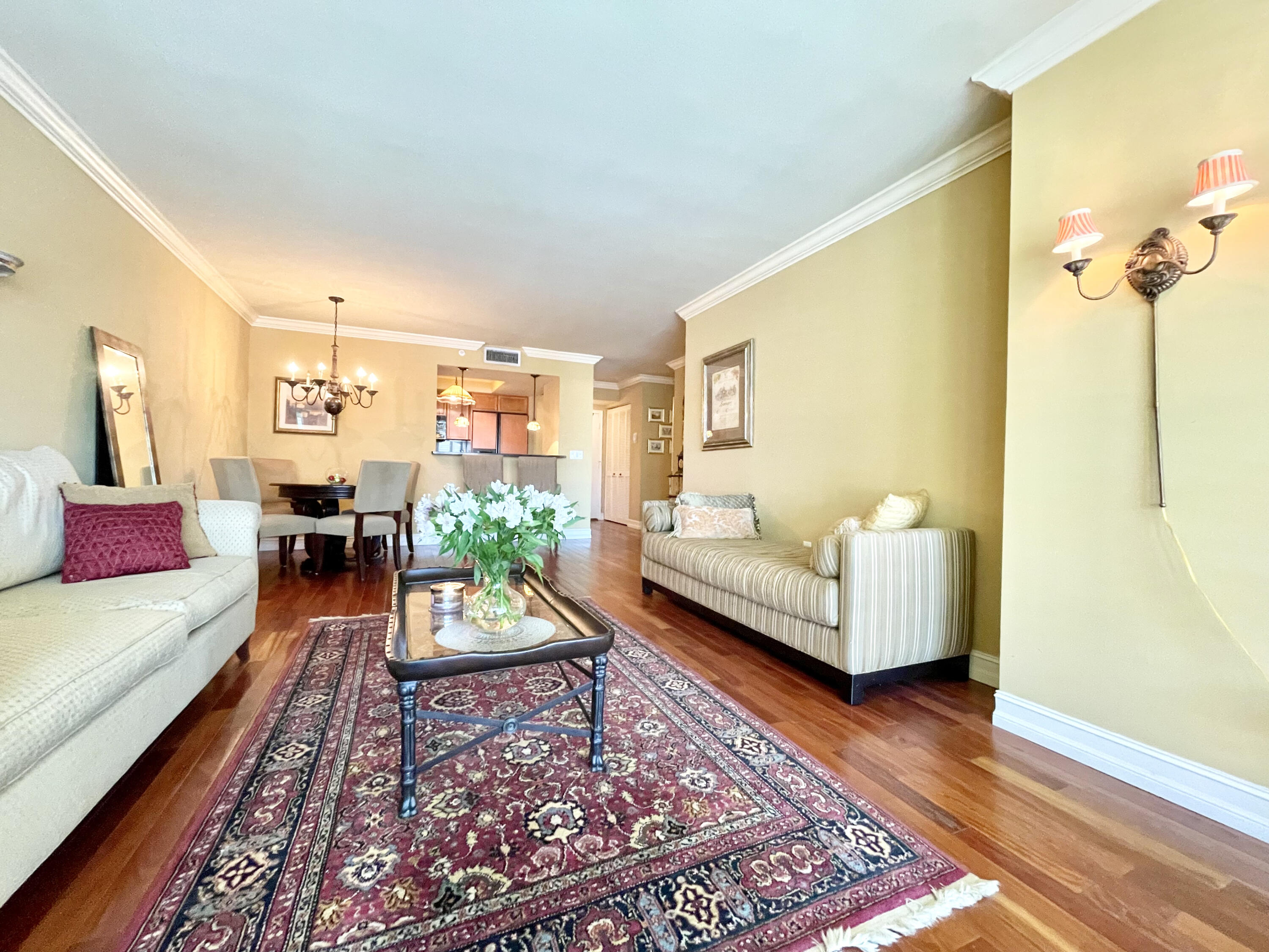 99 Southeast Mizner Boulevard, Unit 223 Boca Raton, FL 33432 - Photo 8 of 23 Living Room w/hardwood floors