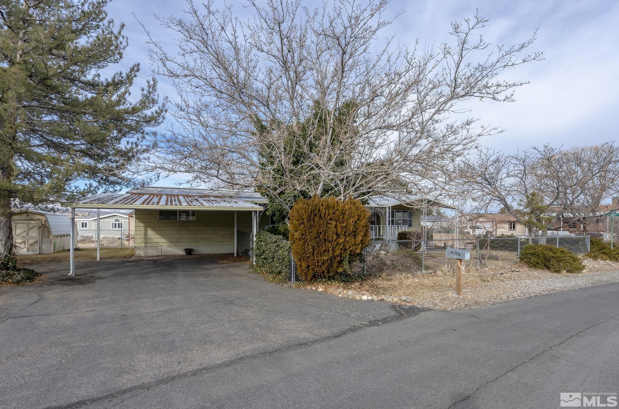 16305 Rhyolite Circle Reno, NV 89521 - Photo 1 of 16 a view of a car parked in front of house