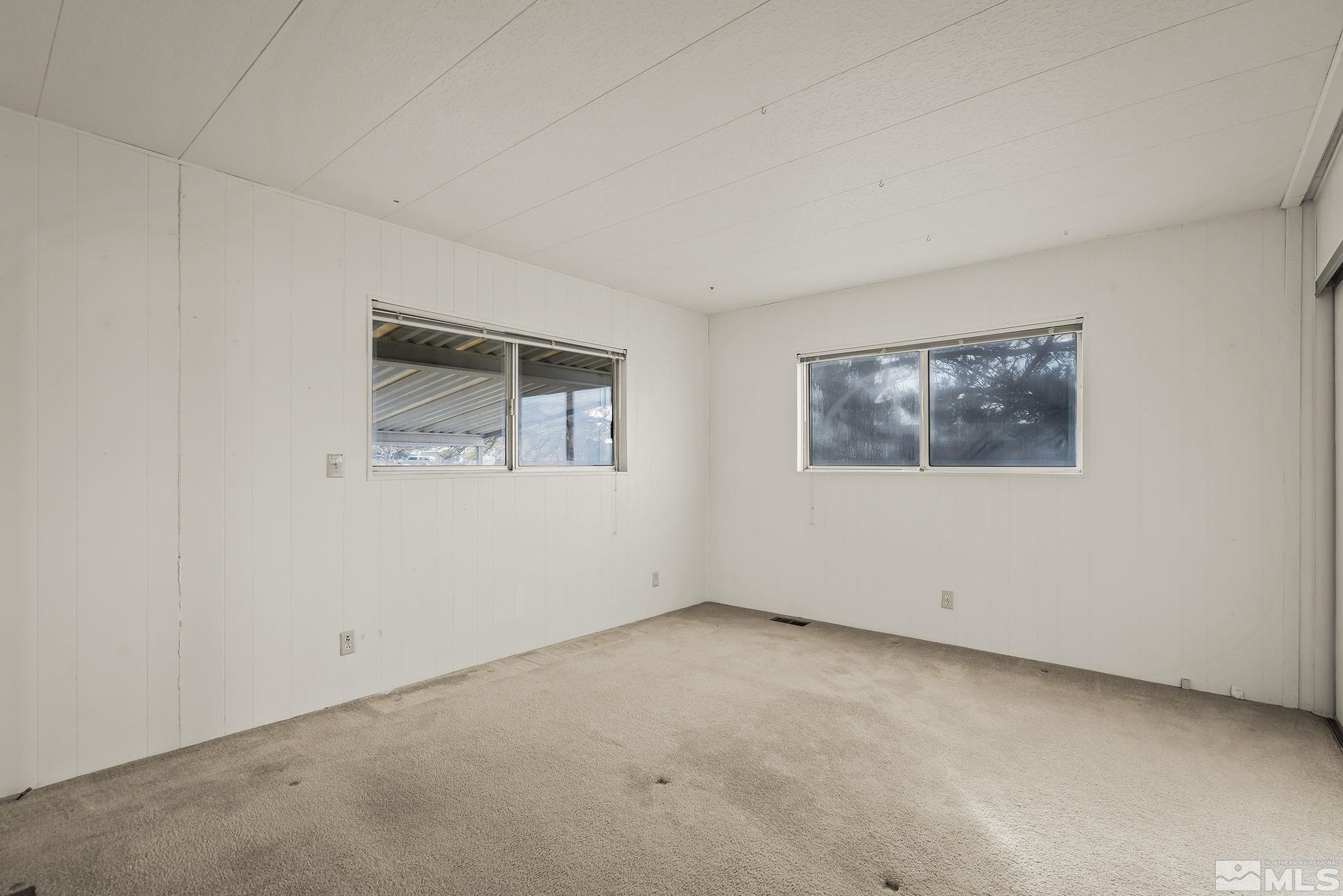 16305 Rhyolite Circle Reno, NV 89521 - Photo 11 of 16 an empty room with windows