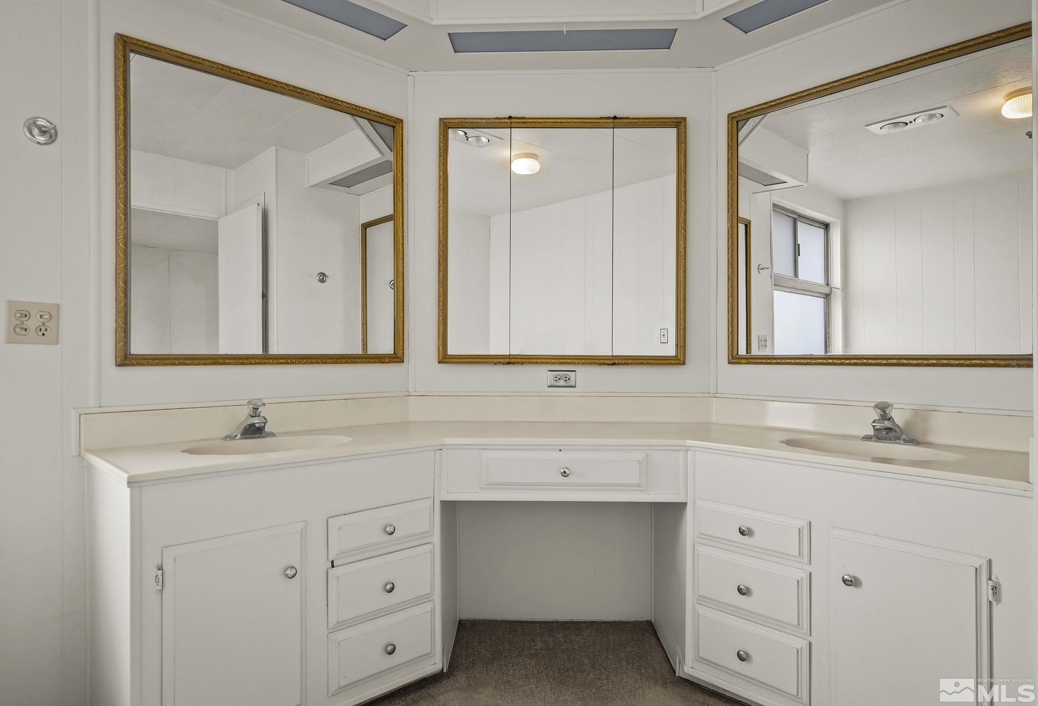 16305 Rhyolite Circle Reno, NV 89521 - Photo 13 of 16 a bathroom with a sink and a mirror