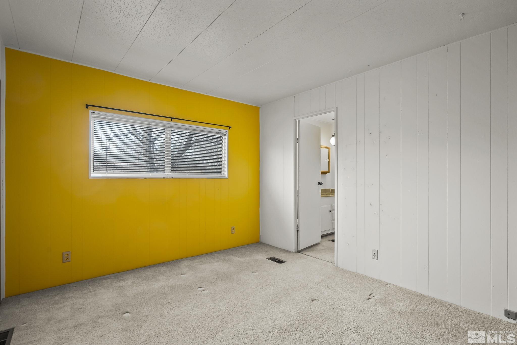 16305 Rhyolite Circle Reno, NV 89521 - Photo 14 of 16 an empty room with windows