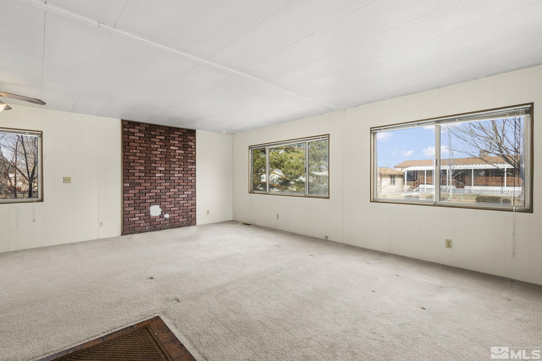 16305 Rhyolite Circle Reno, NV 89521 - Photo 3 of 16 an empty room with windows