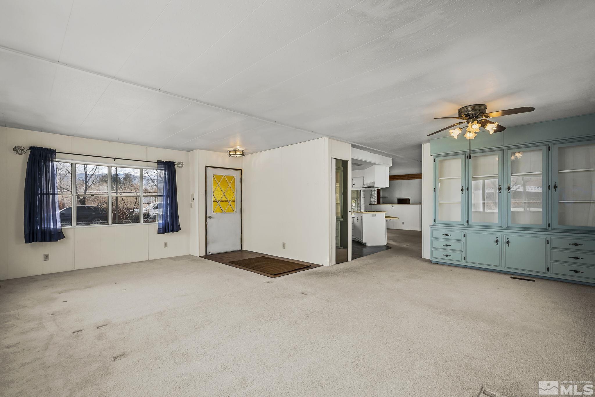 16305 Rhyolite Circle Reno, NV 89521 - Photo 5 of 16 a view of an empty room with a window