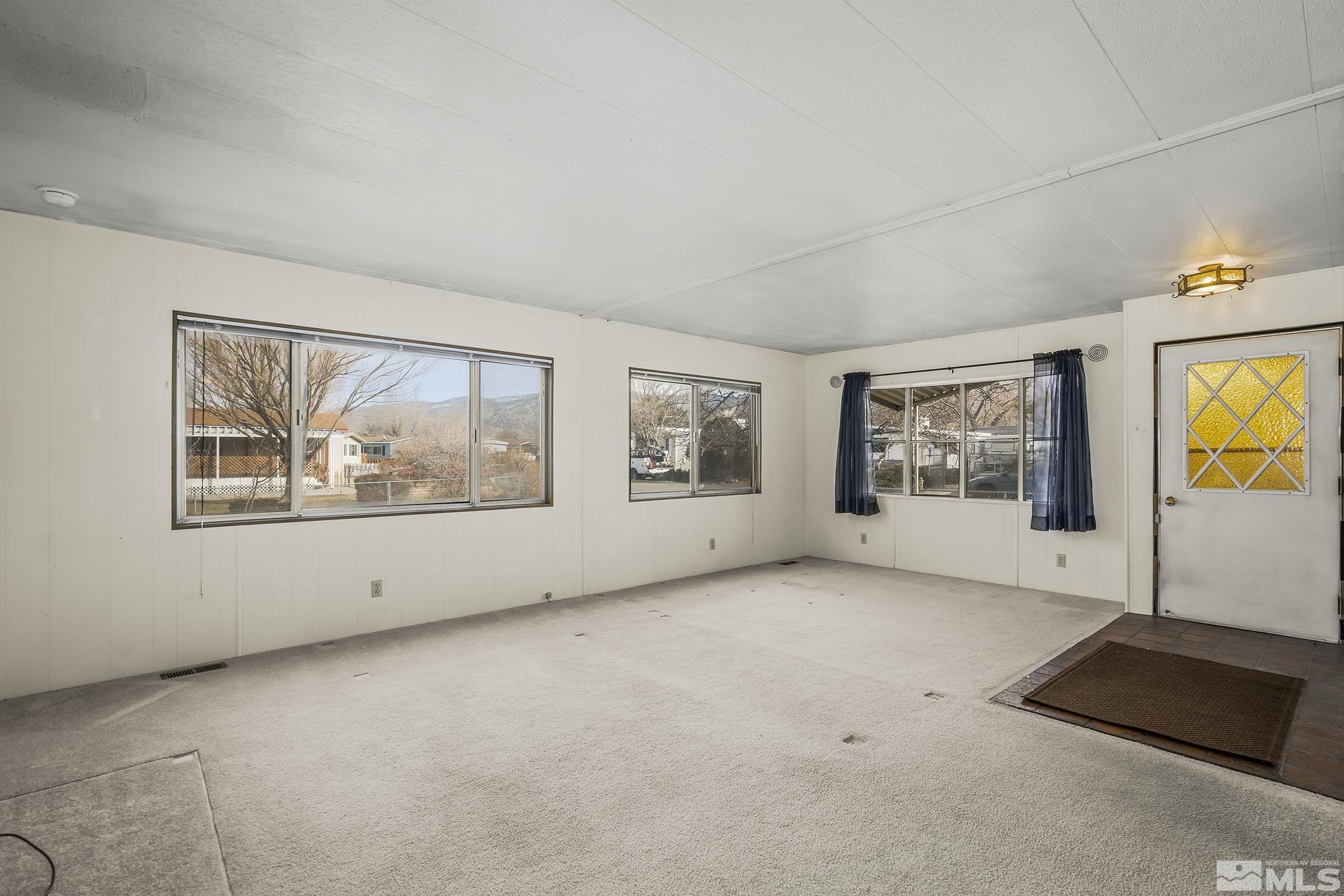 16305 Rhyolite Circle Reno, NV 89521 - Photo 6 of 16 an empty room with windows and closet