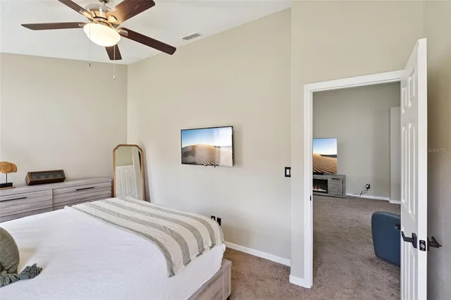 a bedroom with bed and window