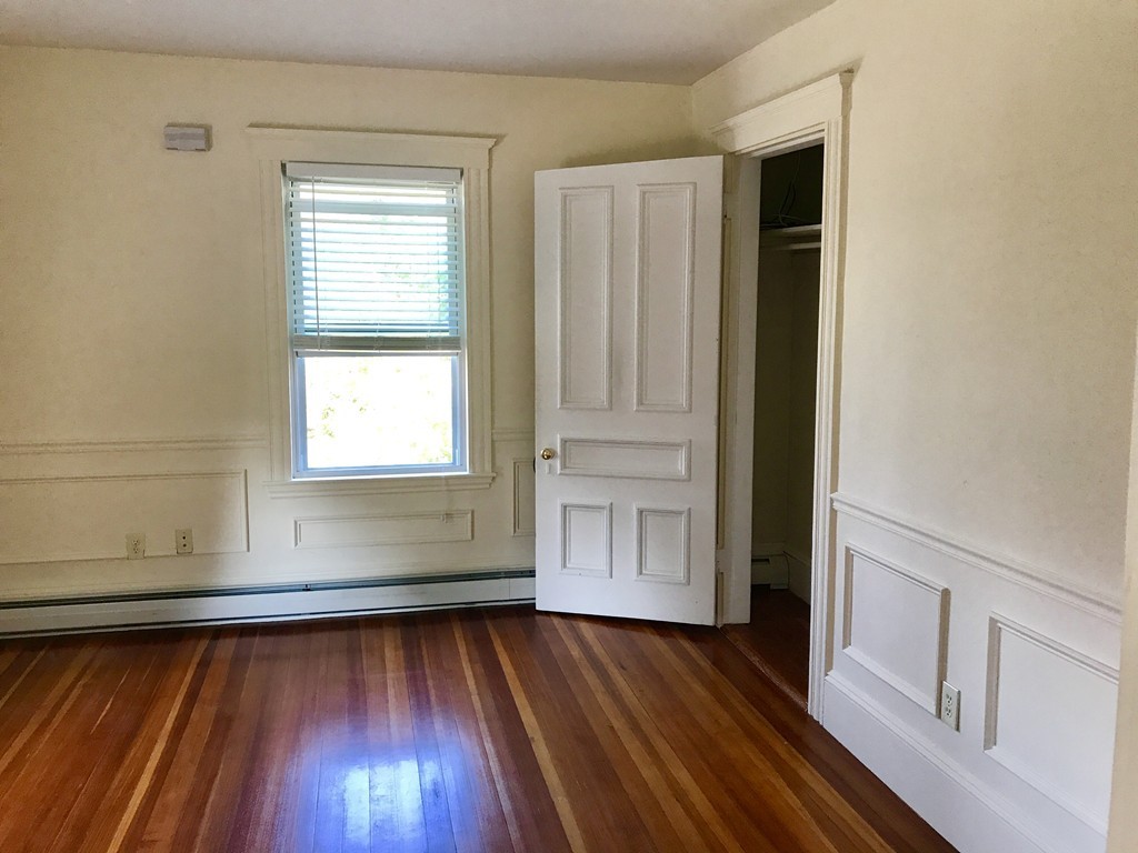 27-29 Topsfield Road, Unit 4 Ipswich, MA 01938 - Photo 8 of 22 a view of empty room with wooden floor and fan