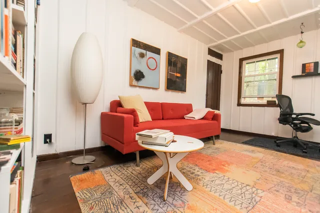 a house view with a swimming pool in front of house