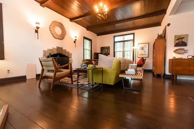 a room with lots of chairs and wooden floor