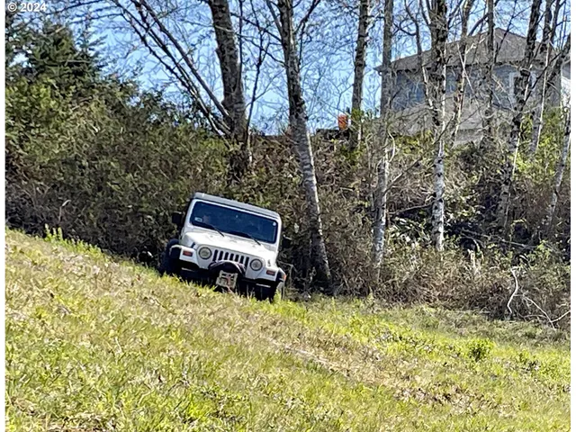 a view of wooden fence and trees
