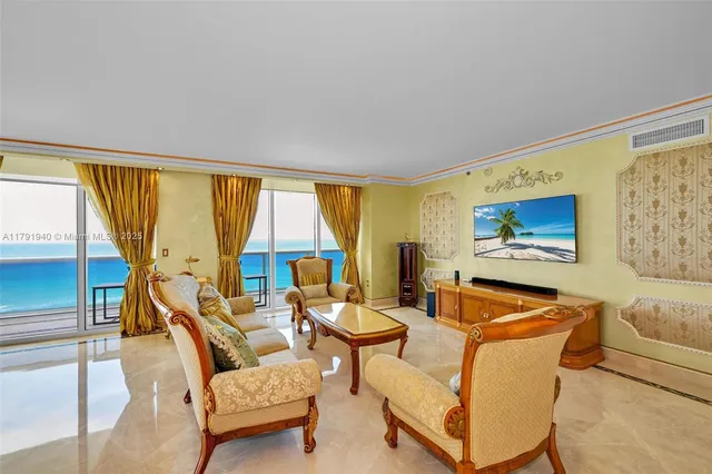 a living room with furniture and a large window