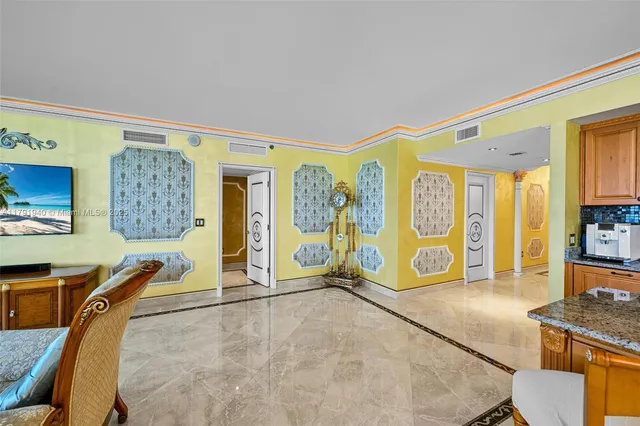 a living room with furniture window and wooden floor