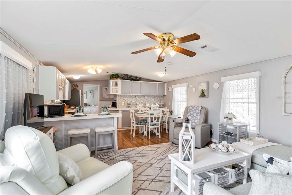 10303 Burnt Store Road, Unit 230 Punta Gorda, FL 33950 - Photo 11 of 27 a living room with lots of furniture and kitchen view