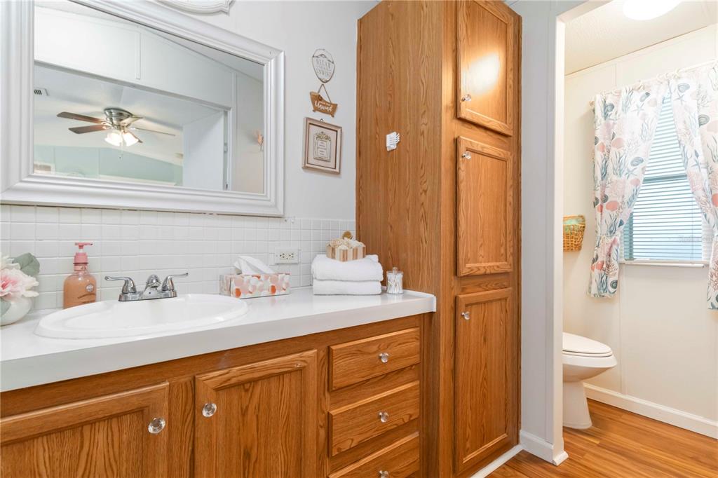 10303 Burnt Store Road, Unit 230 Punta Gorda, FL 33950 - Photo 15 of 27 a bathroom with a granite countertop sink and a mirror