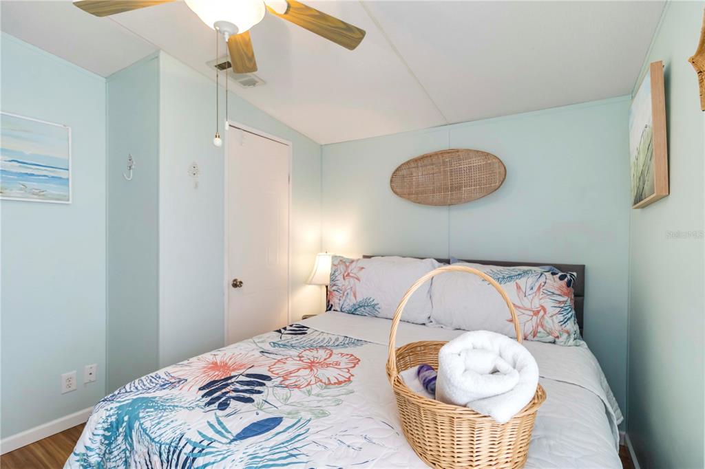 10303 Burnt Store Road, Unit 230 Punta Gorda, FL 33950 - Photo 16 of 27 a bedroom with a bed and a window