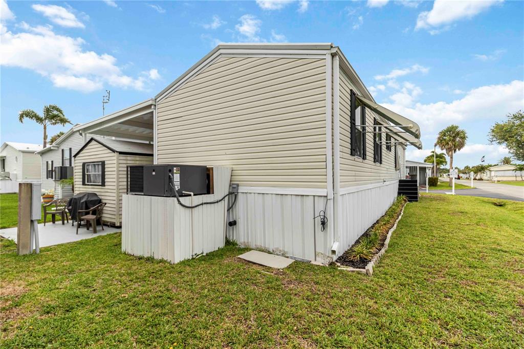 10303 Burnt Store Road, Unit 230 Punta Gorda, FL 33950 - Photo 21 of 27 a view of a house with backyard and sitting area