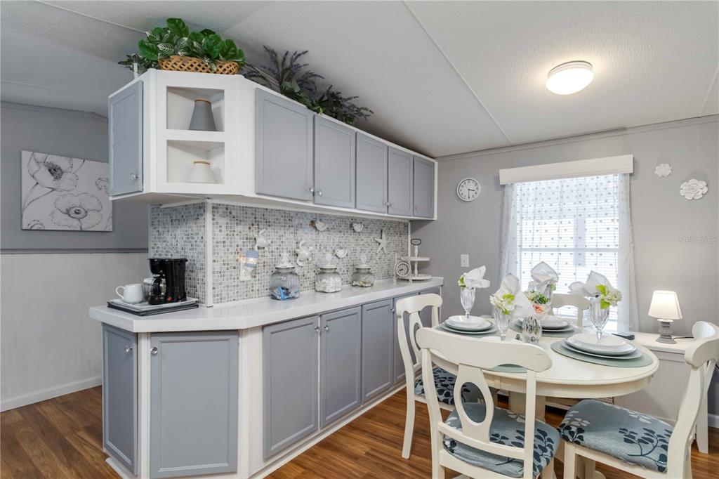 10303 Burnt Store Road, Unit 230 Punta Gorda, FL 33950 - Photo 4 of 27 a kitchen with a sink cabinets and window