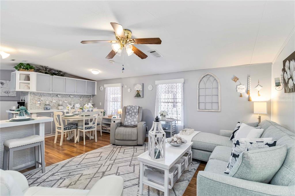 10303 Burnt Store Road, Unit 230 Punta Gorda, FL 33950 - Photo 8 of 27 a living room with furniture and a large window