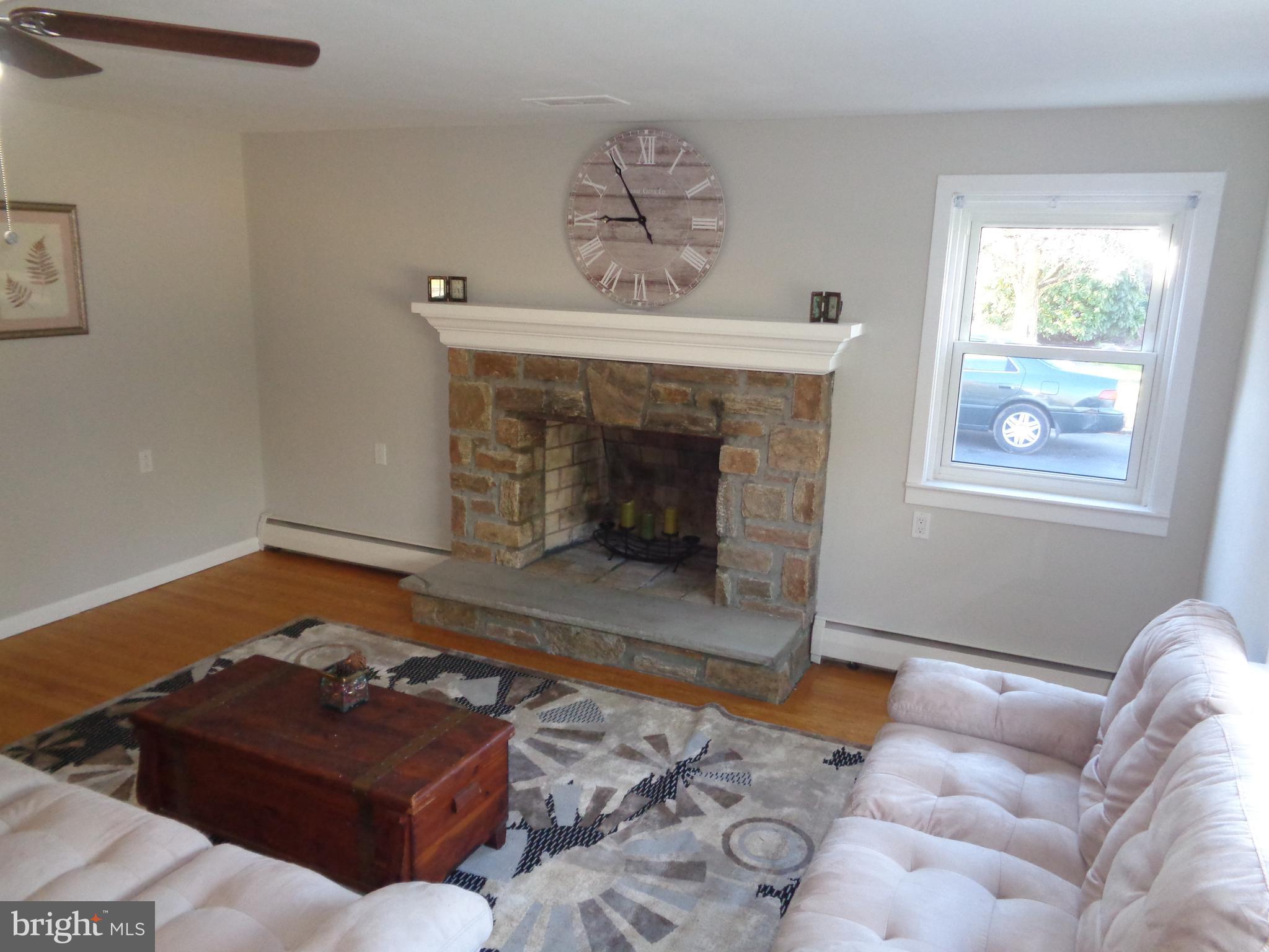 311 Evergreen Road Horsham, PA 19044 - Photo 8 of 26 Living room with wood burning stone fireplace