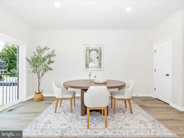 a workspace with wooden floor and a window