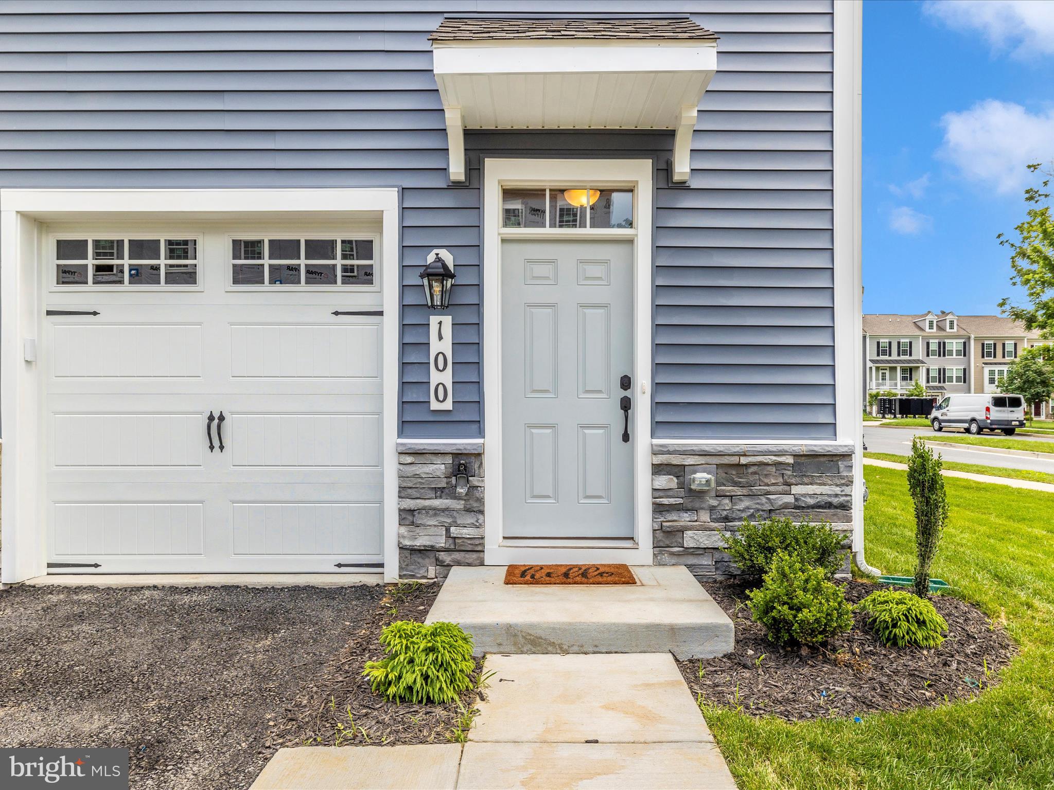 100 Spring Bank Way Frederick, MD 21701 - Photo 3 of 43 a front view of a house with a garden