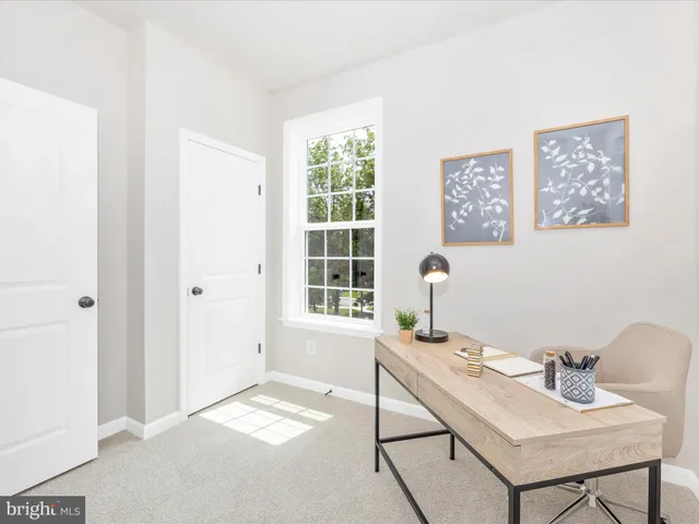 a bedroom with a bed and a lamp