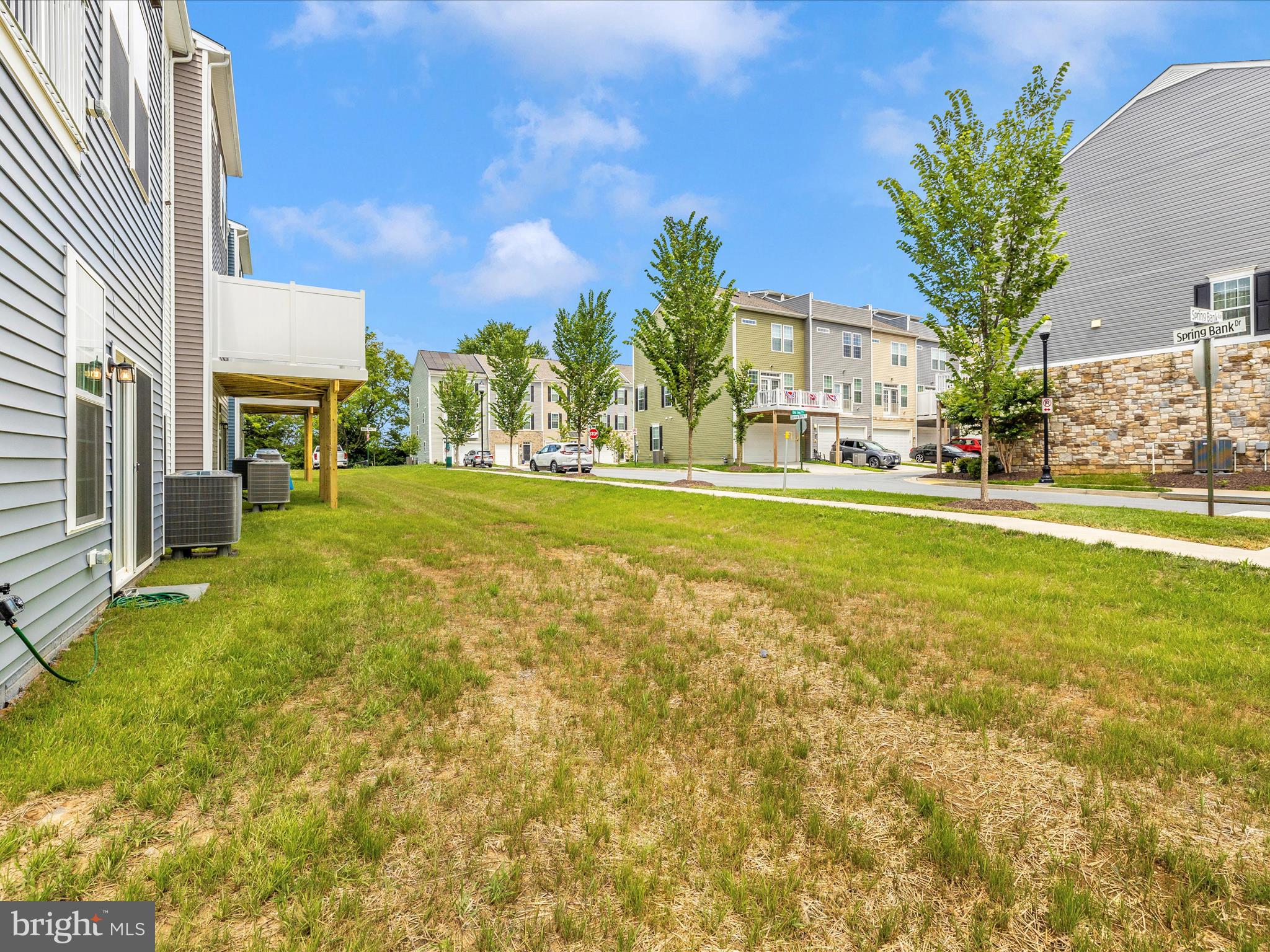 100 Spring Bank Way Frederick, MD 21701 - Photo 40 of 43 a view of a house with a yard and garage