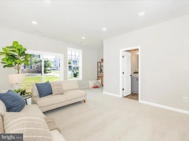 a bathroom with a toilet a sink and a mirror