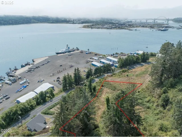 an aerial view of ocean with residential house and ocean view