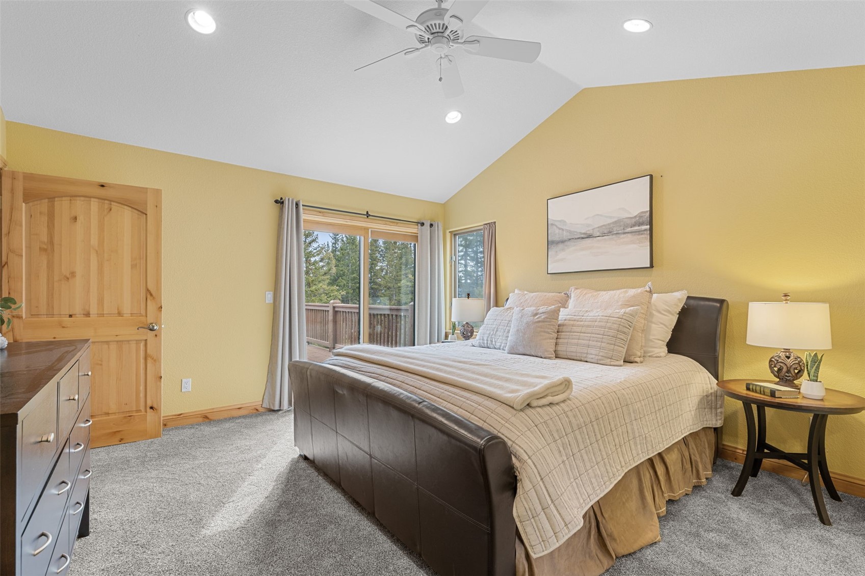 91795 Ryan Gulch Road Silverthorne, CO 80498 - Photo 3 of 50 a bedroom with a bed and a chandelier