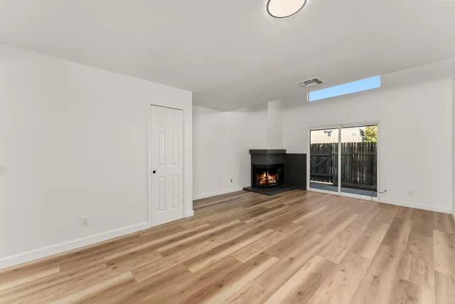 a bedroom with a bed and a fireplace