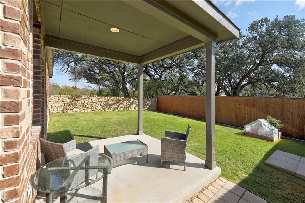 204 Tulum Terrace Leander, TX 78641 - Photo 18 of 22 Fenced backyard with a patio area