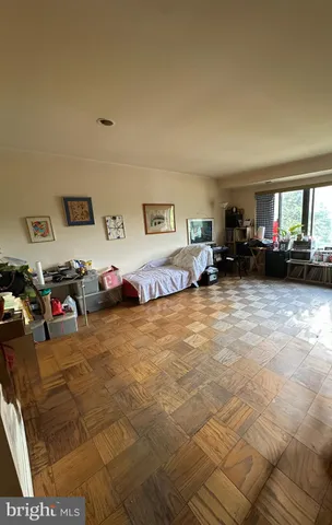 a bed room with furniture and a window